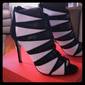 Black and white peep toe pumps